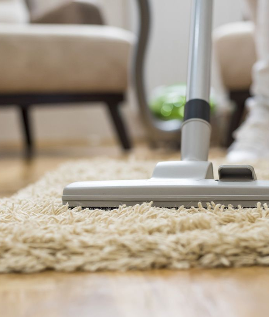 technician cleaning area rug
